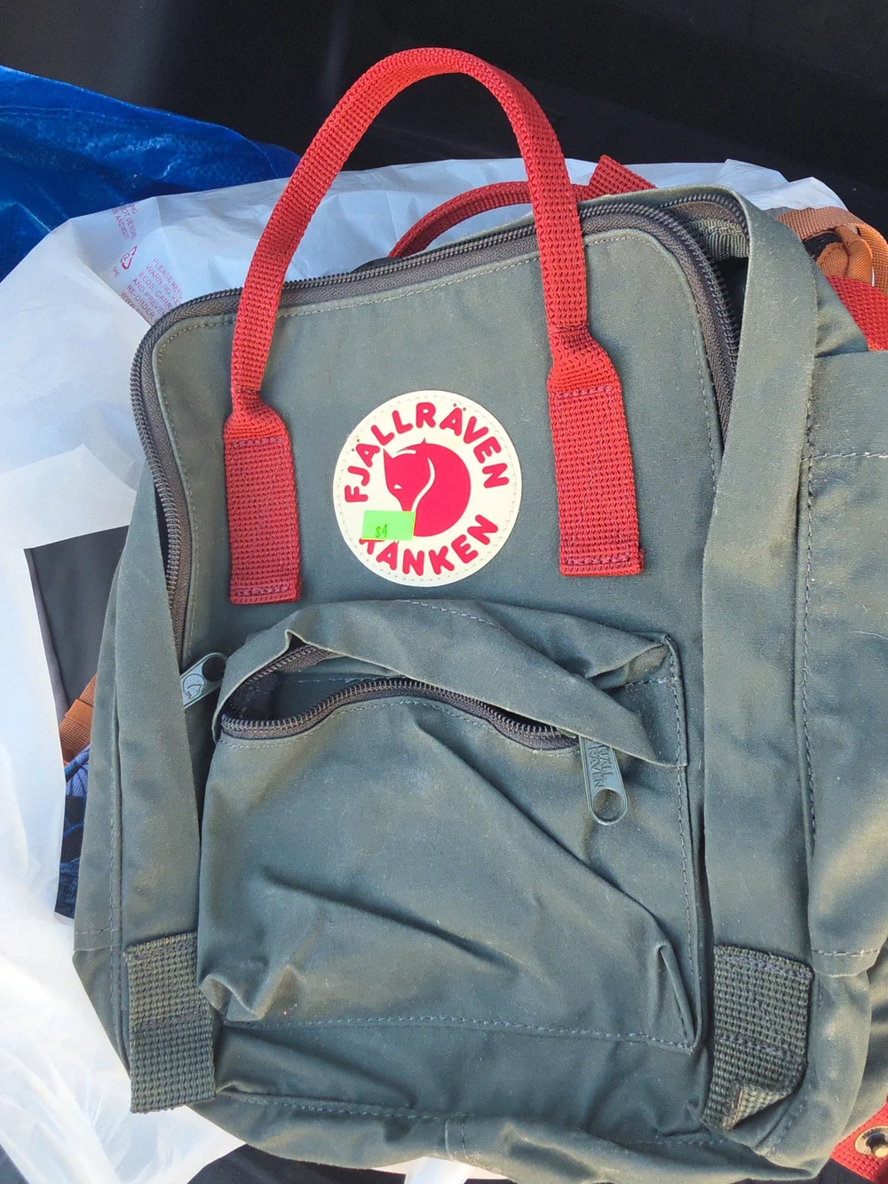 Gray Fjallraven Backpack with Red Accents